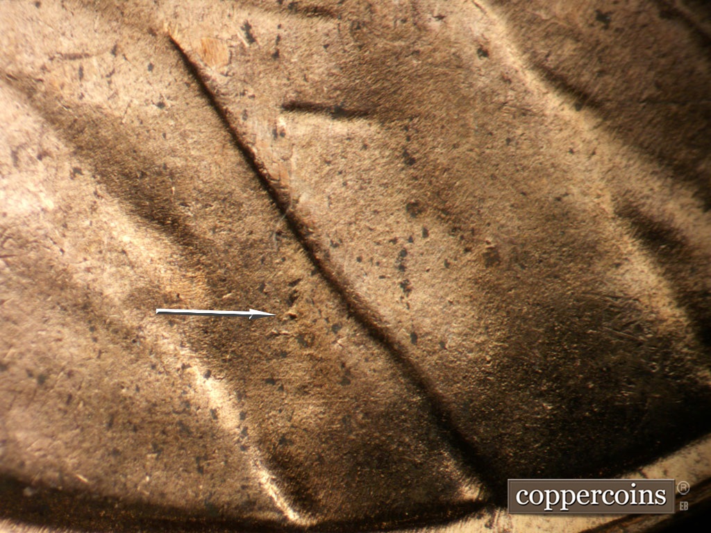 Die-stage B marker on 1953D•1MM•053 showing Die dot on jacket.