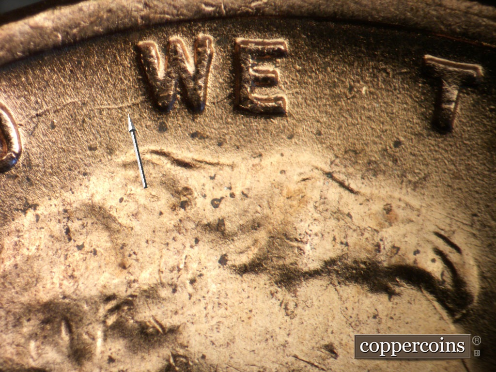 Die-stage B marker on 1953D•1MM•053 showing E/W die scratch from W in WE.