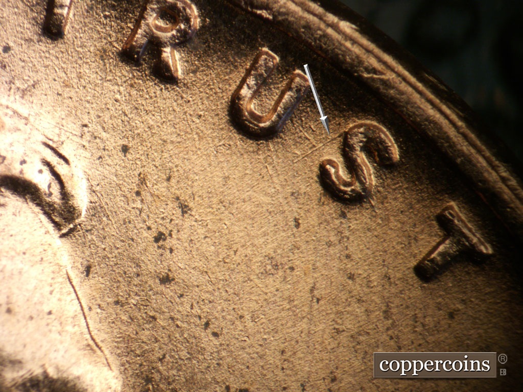Die-stage B marker on 1953D•1MM•053 showing SW die scratch from S in TRUST.
