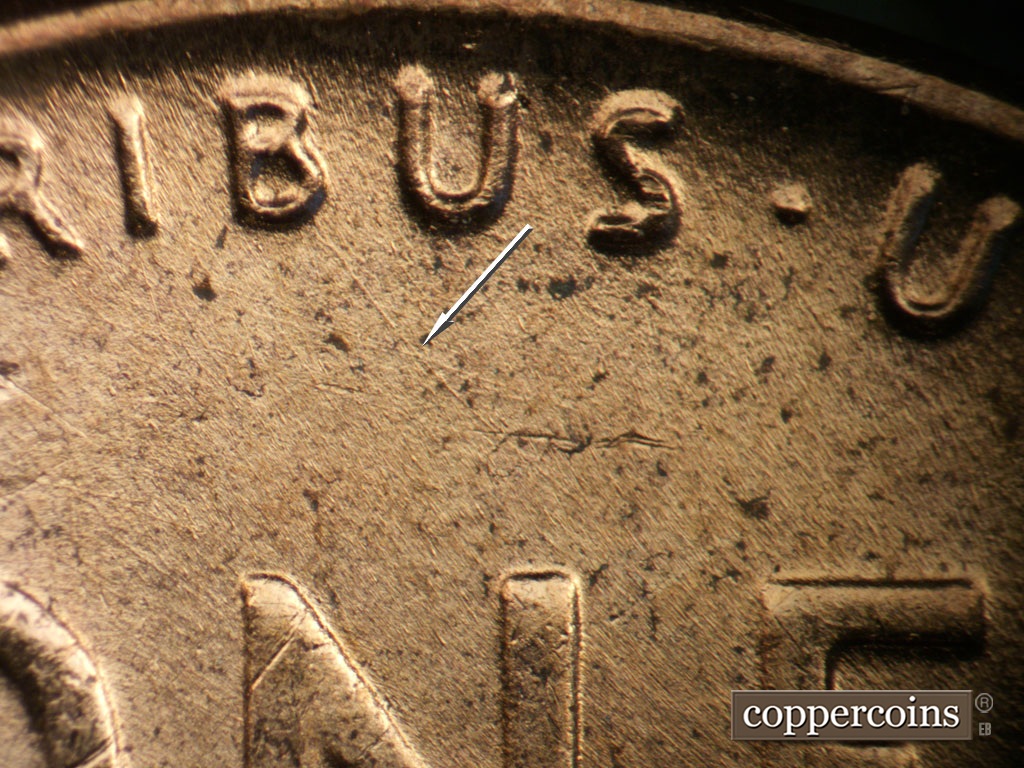 Die-stage B marker on 1953D•1MM•053 showing SE die scratch from B in PLURIBUS.