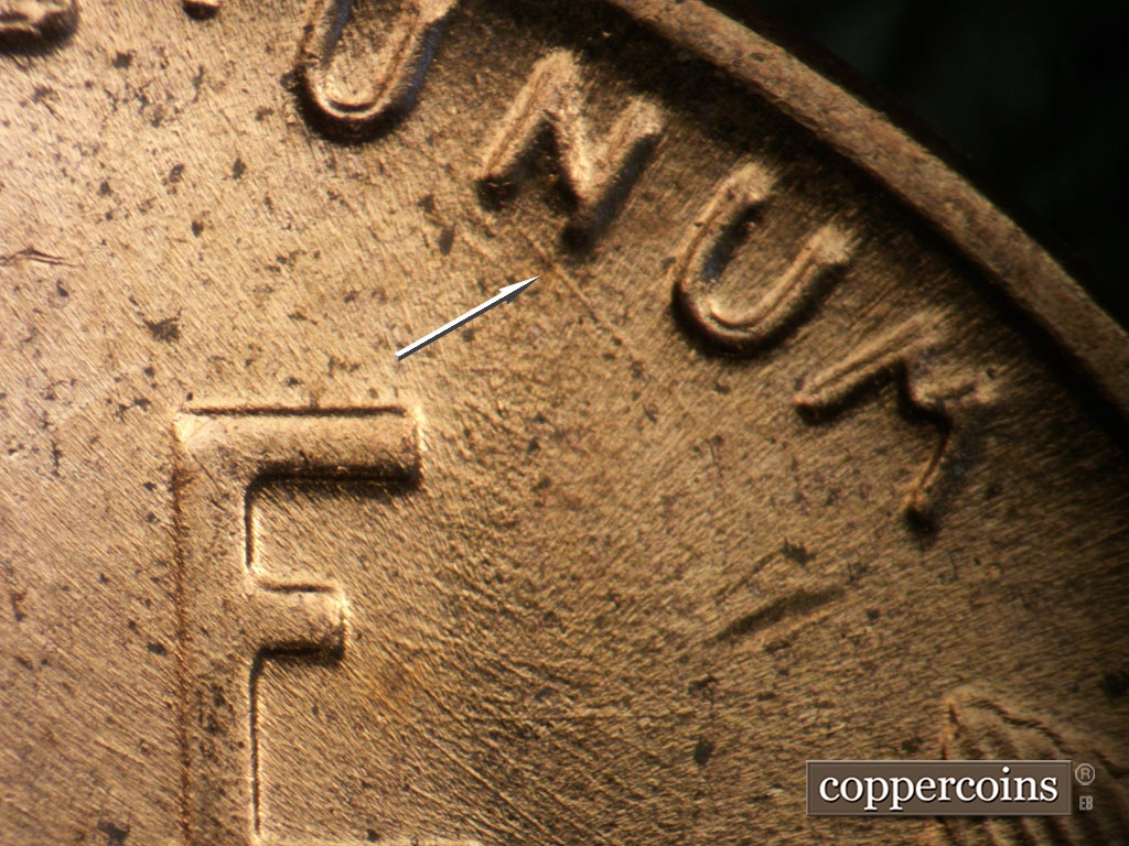 Die-stage B marker on 1953D•1MM•053 showing SE die scratch from N in UNUM.
