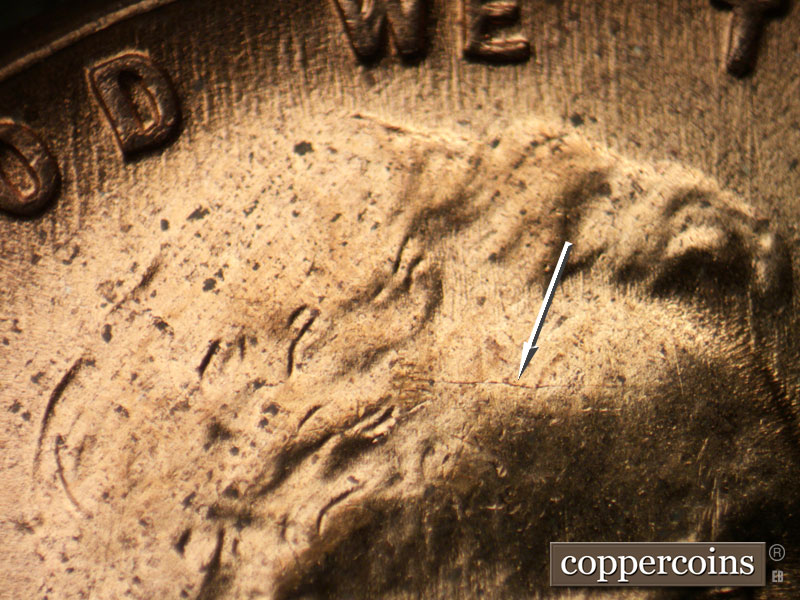 Die-stage C marker on 1953D•1MM•054 showing Die crack across forehead.