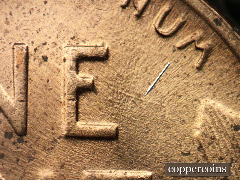 Die-stage C marker on 1953D•1MM•054 showing ESE die scratch from middle leg of E in ONE.