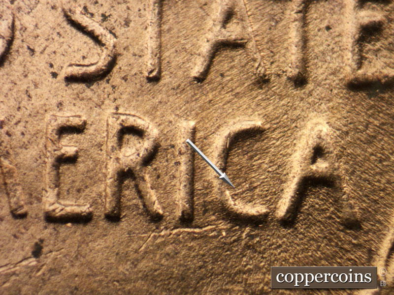 Die-stage C marker on 1953D•1MM•054 showing ENE die scratch in C of AMERICA.