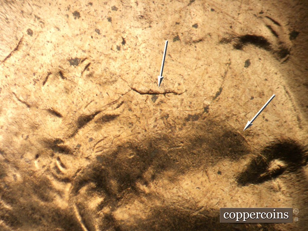 Die-stage C marker on 1953D•1MM•062 showing Die crack in hair extends into forehead.