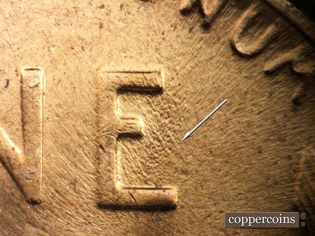 Die-stage C marker on 1953D•1MM•062 showing Worn SE die scratch in E of ONE.