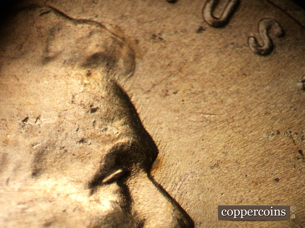 Die-stage B marker on 1953D•1MM•064 showing Short NE die scratches from profile.