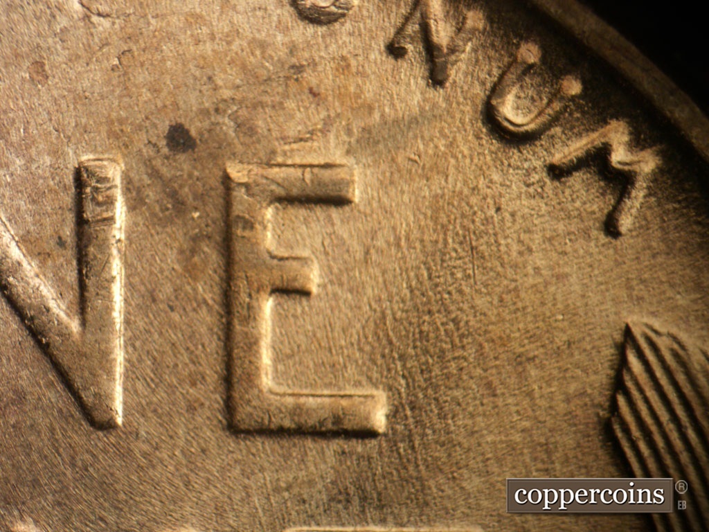Die-stage B marker on 1953D•1MM•064 showing SSE die scratches in field east of E in ONE.