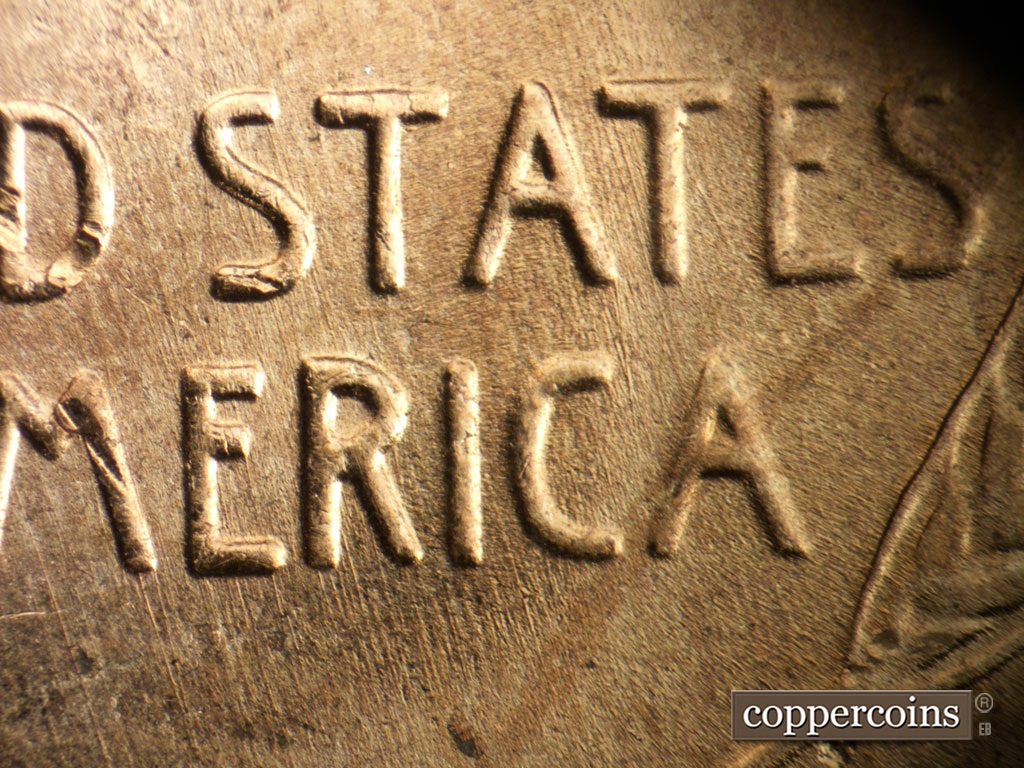 Die-stage B marker on 1953D•1MM•064 showing SSE die scratches through STATES and AMERICA.