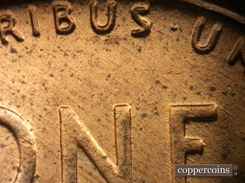 Die-stage B marker on 1953D•1MM•065 showing SE die scratches cover top of reverse.