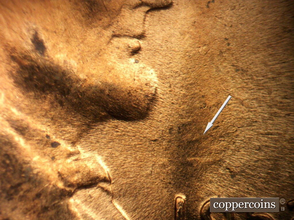 Die-stage B marker on 1953D•1MM•067 showing Die clash east of throat.