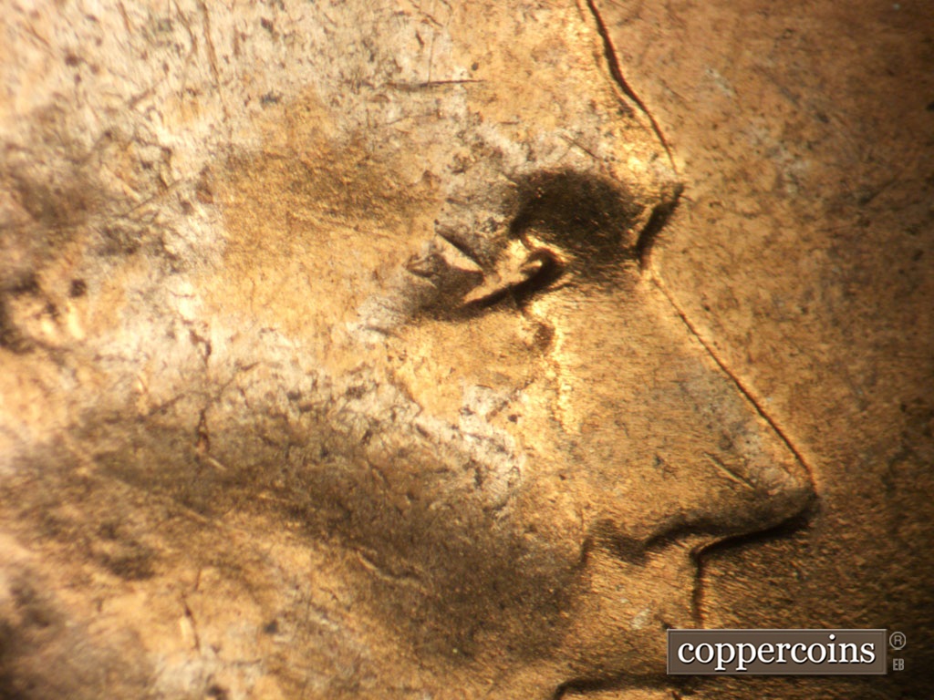Die-stage A marker on 1953P•1DO•003 showing Extra upper eyelid south of primary.