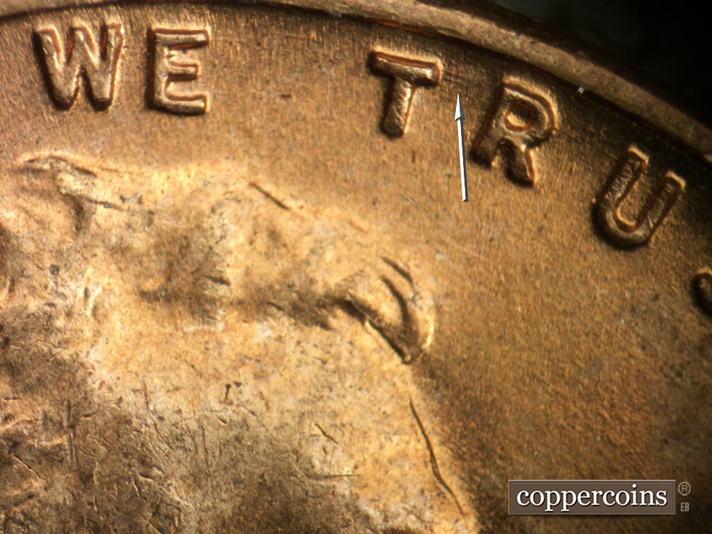 Die-stage A marker on 1953P•1DO•003 showing Concentric die scratches between TR in TRUST.