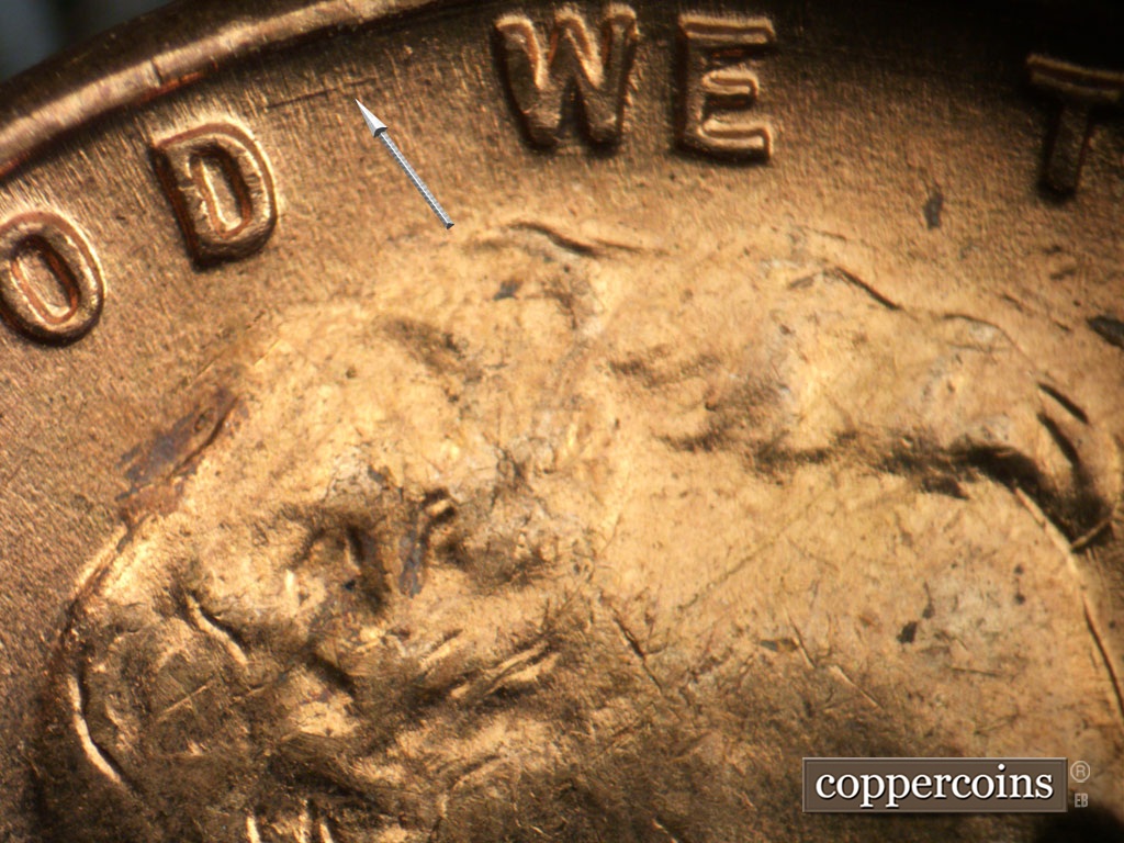Die-stage B marker on 1953P•1DO•004 showing ENE die scratch from D in GOD.