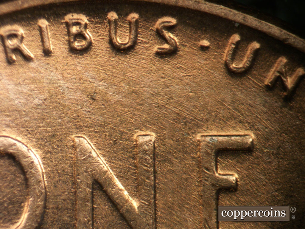 Die-stage B marker on 1953P•1DO•004 showing Concentric die scratches cover top of reverse.