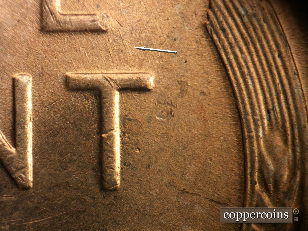 Die-stage B marker on 1953P•1DO•004 showing SSE die scratches connect E in ONR to top of T in CENT.