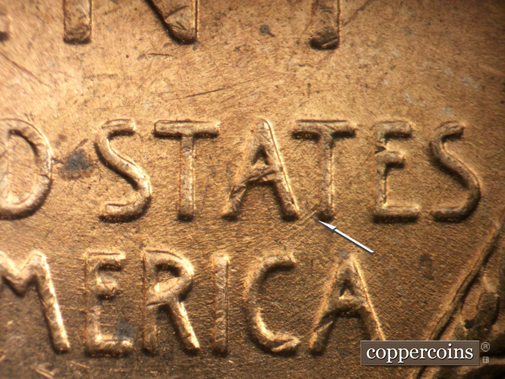 Die-stage B marker on 1953P•1DO•004 showing SW die scratches connect T in STATES to C in AMERICA.