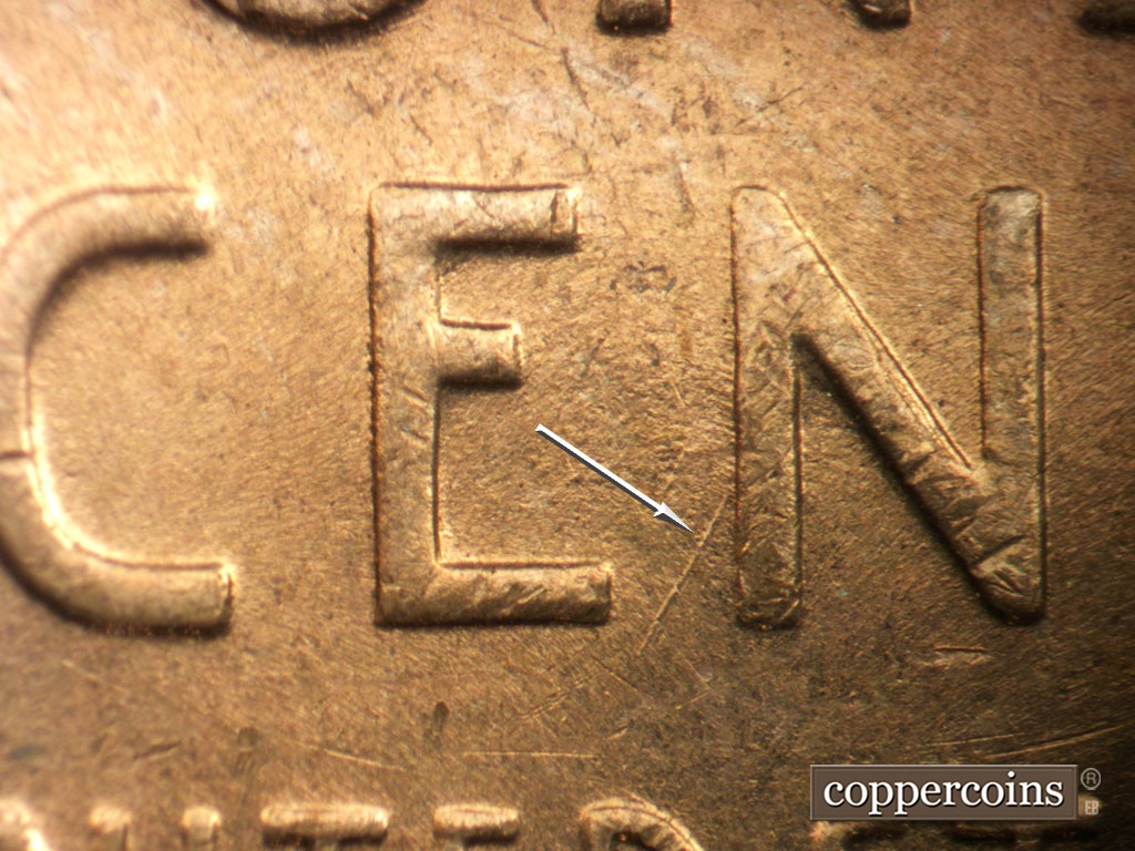 Die-stage B marker on 1953P•1DO•004 showing SW die scratch from N in CENT.