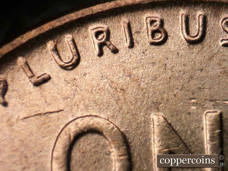 Die-stage B marker on 1954D•1DR•001 (1954 Doubled Die Reverse).