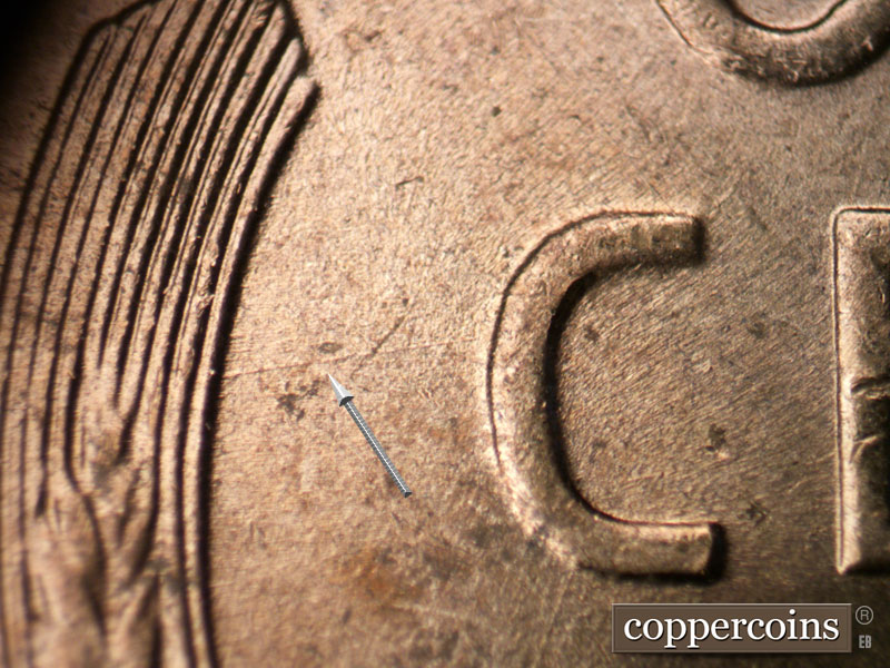 Die-stage B marker on 1954D•1DR•001 (1954 Doubled Die Reverse).
