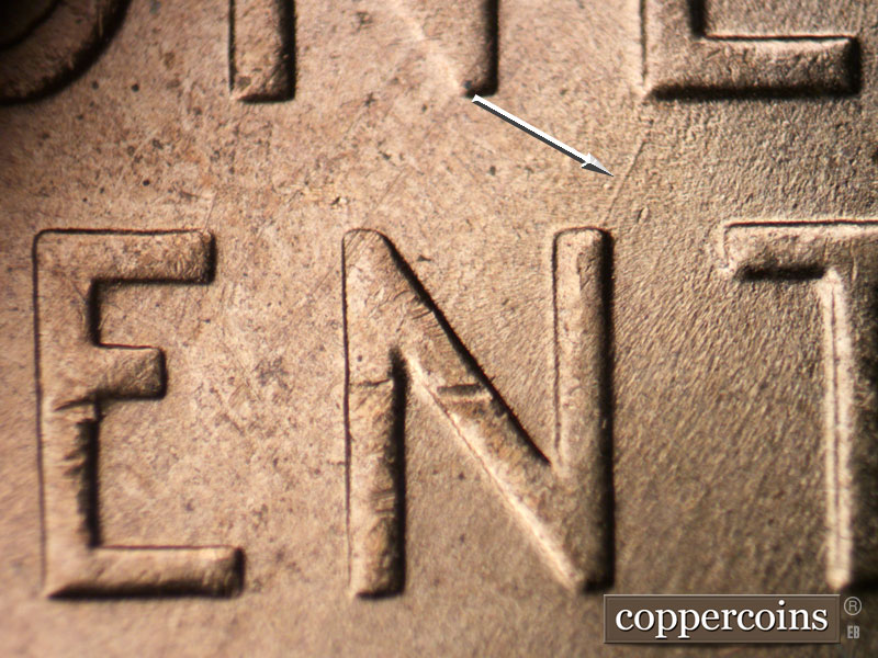 Die-stage B marker on 1954D•1DR•001 (1954 Doubled Die Reverse).
