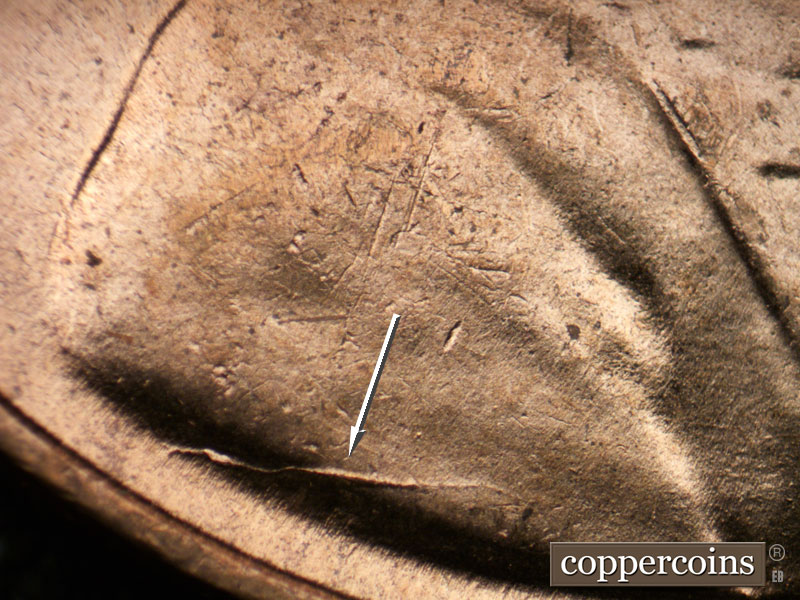 Die-stage B marker on 1954D•1DR•001 (1954 Doubled Die Reverse).