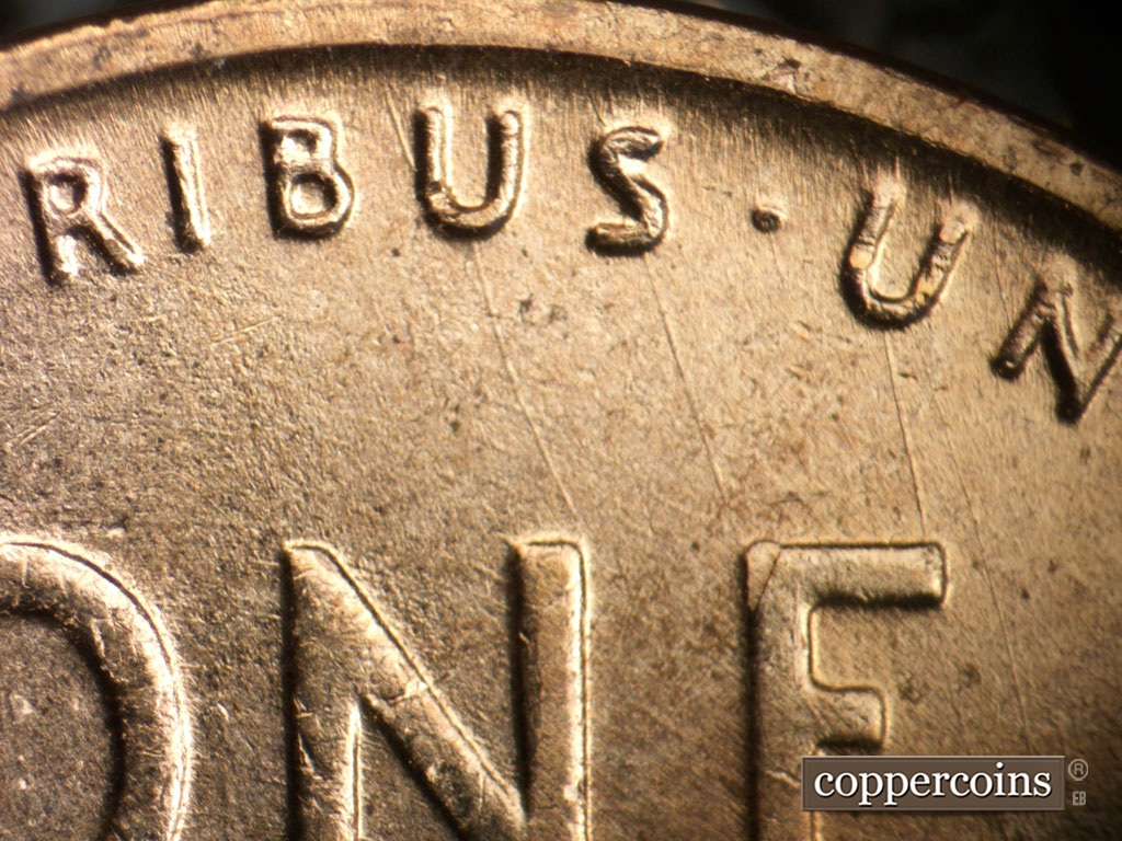 Die-stage B marker on 1954D•1MM•046 showing 3 SSE die scratches connect US U in E PLURIBUS UNUM to NE in ONE.