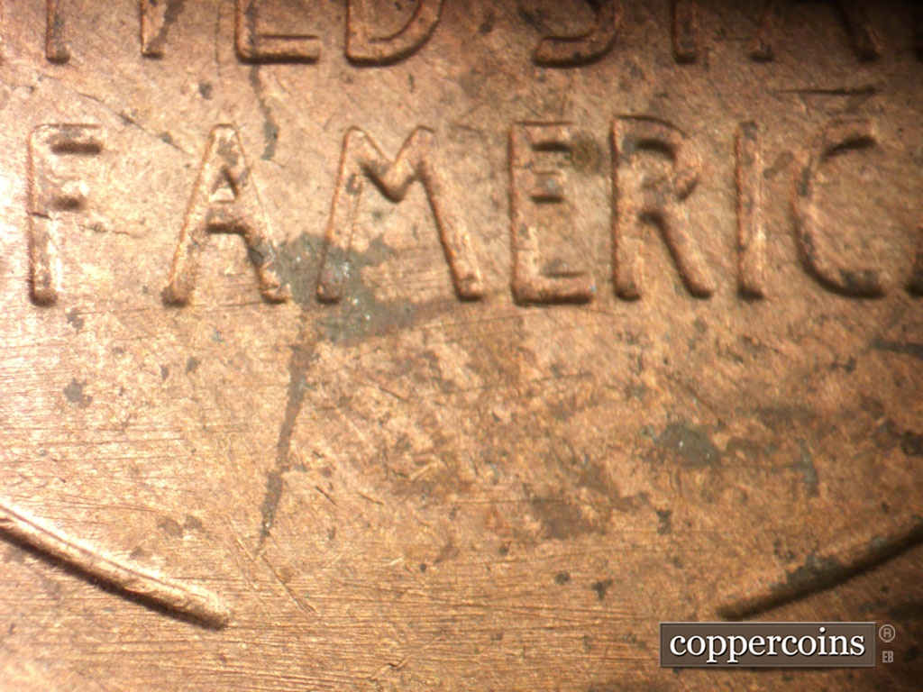Die-stage C marker on 1954P•1DO•001 showing E/W die scratches through reverse.