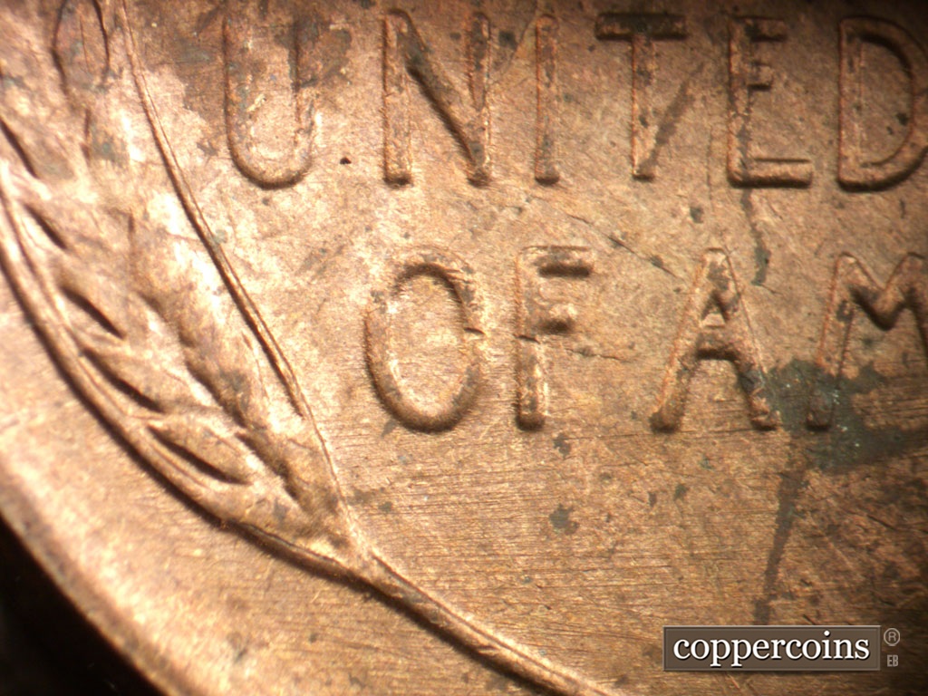Die-stage C marker on 1954P•1DO•001 showing E/W die scratches through reverse.