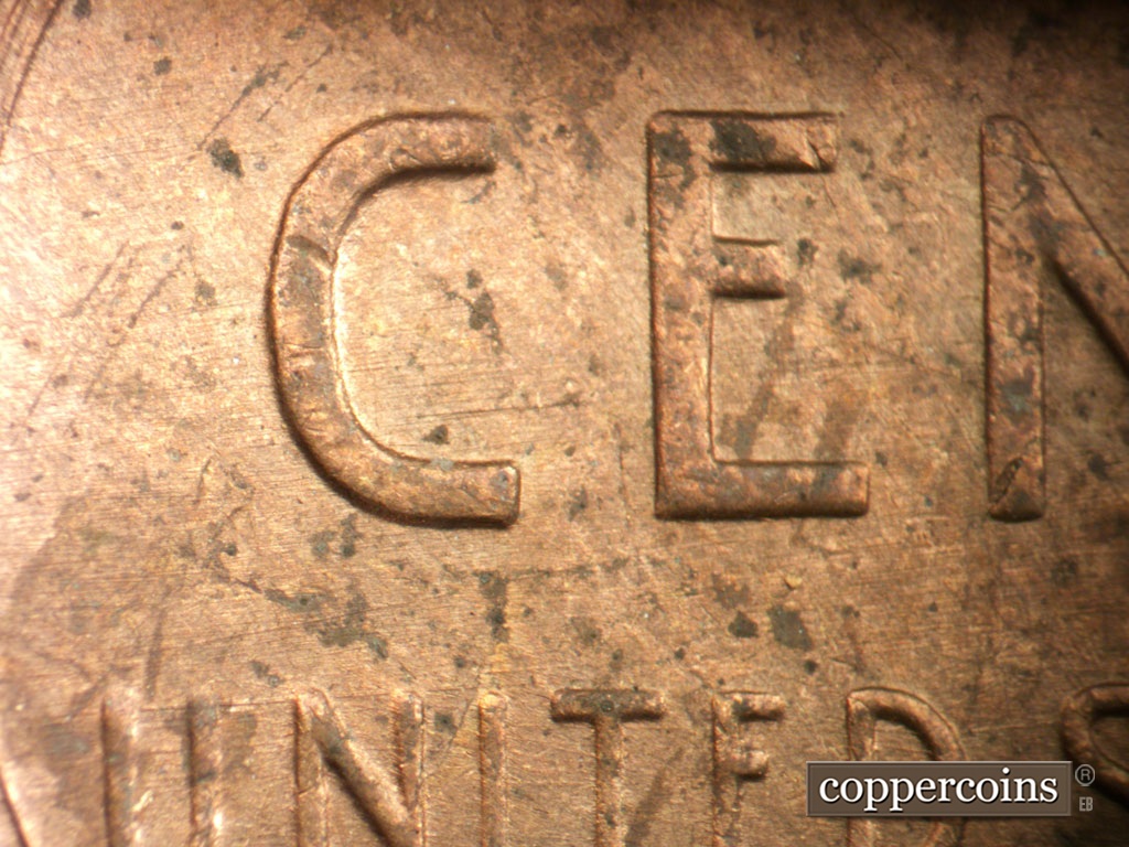 Die-stage C marker on 1954P•1DO•001 showing E/W die scratches through reverse.