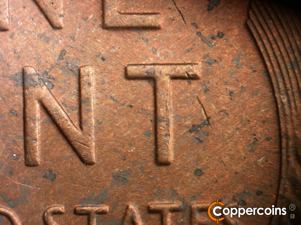 Die-stage B marker on 1954P•1DO•004 showing Die crack on vertical of T in CENT.
