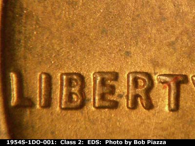 Die-stage A marker on 1954S•1DO•001 (1954 Doubled Die Obverse).