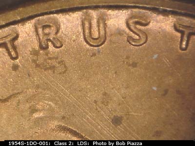 Die-stage C marker on 1954S•1DO•001 (1954 Doubled Die Obverse).