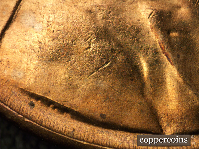 Die-stage C marker on 1954S•1MM•002 showing A die crack shows at the base of the bust above VDB on the shoulder.