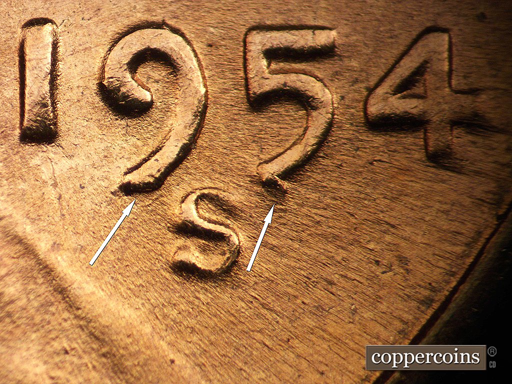 Die-stage D marker on 1954S•1MM•002 showing Die chips on 9 and 5 of date.