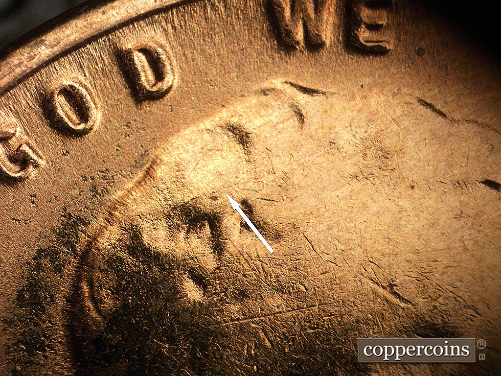 Die-stage D marker on 1954S•1MM•002 showing Die crack in hair.