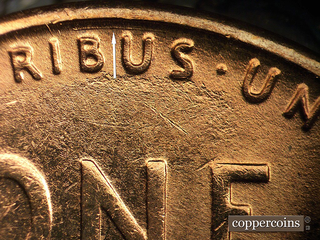 Die-stage D marker on 1954S•1MM•002 showing Concentric die scratch between BU in PLURIBUS and rim.