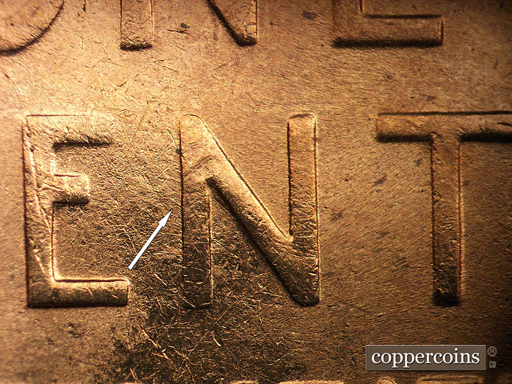 Die-stage D marker on 1954S•1MM•002 showing Short NW die scratch from side of N in CENT.