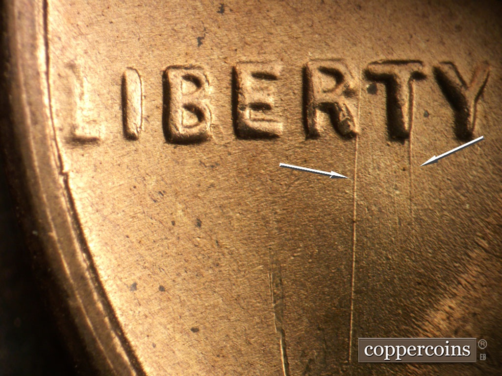 Die-stage D marker on 1954S•1MM•007 showing N?S die scratch through Rand T in LIBERTY.