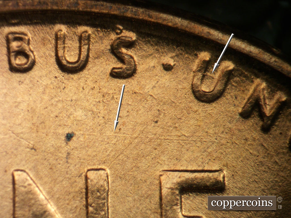 Die-stage D marker on 1954S•1MM•007 showing E/W die scratch above NE in ONE. Die scratch in first U in UNUM.