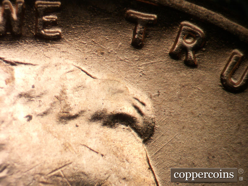 Die-stage A marker on 1955D•1DO•002 (1955 Doubled Die Obverse).
