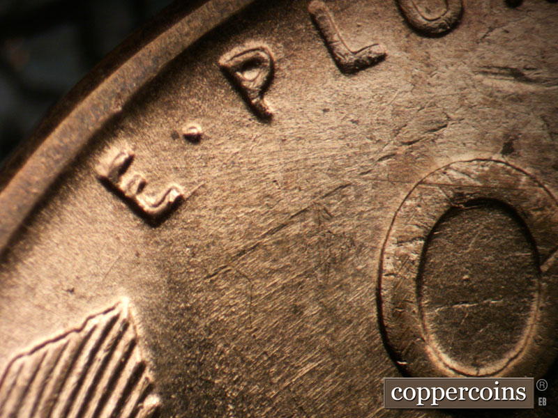 Die-stage A marker on 1955D•1DO•002 (1955 Doubled Die Obverse).