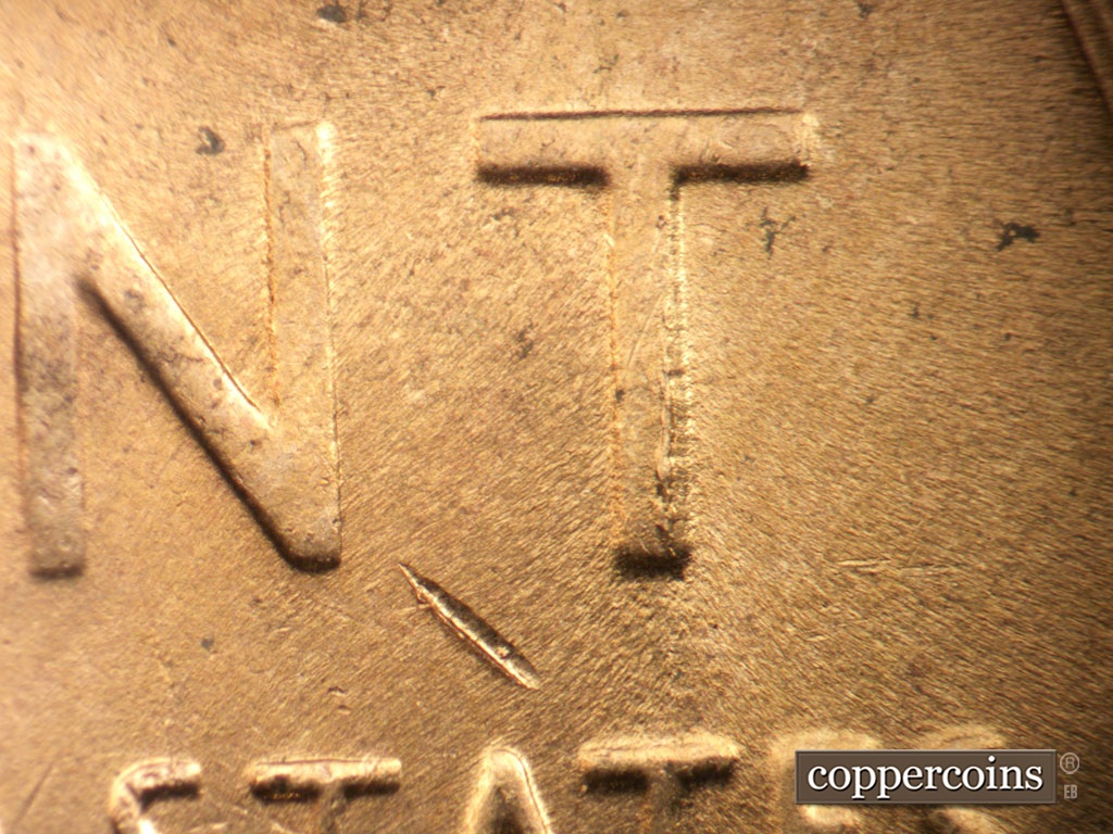 Die-stage C marker on 1955D•1DO•003 showing Die chipping on vertical of T in CENT.