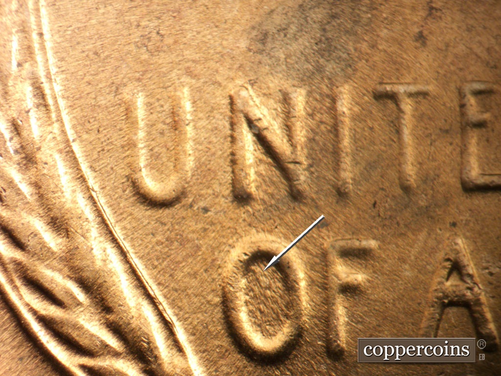 Die-stage C marker on 1955D•1DO•003 showing Worn die scratch inside O in OF.