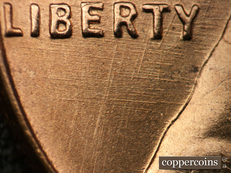Die-stage B marker on 1955D•1DO•008 (1955 Doubled Die Obverse).