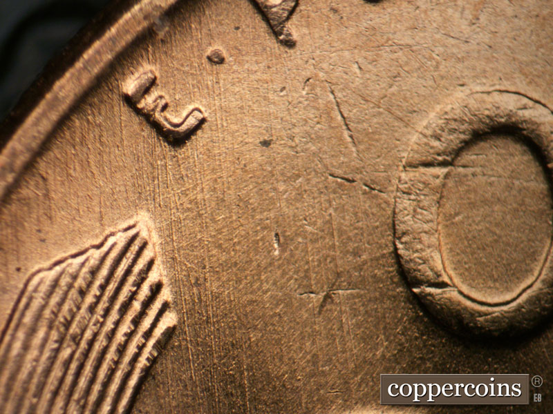 Die-stage B marker on 1955D•1DO•008 (1955 Doubled Die Obverse).