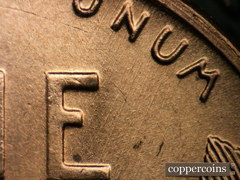 Die-stage B marker on 1955D•1DO•008 (1955 Doubled Die Obverse).