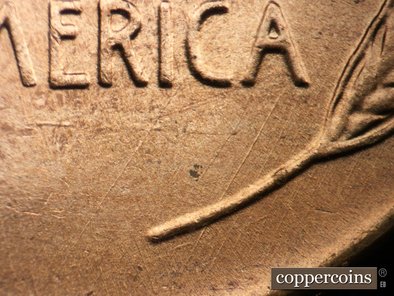 Die-stage B marker on 1955D•1DO•008 (1955 Doubled Die Obverse).