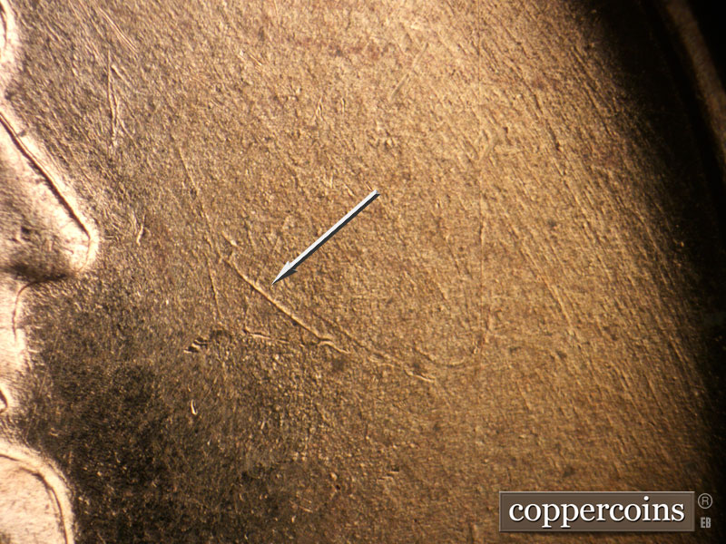 Die-stage B marker on 1955D•1DO•009 (1955 Doubled Die Obverse).