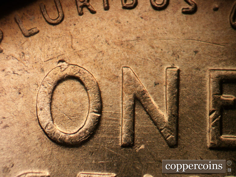 Die-stage B marker on 1955D•1DO•009 (1955 Doubled Die Obverse).